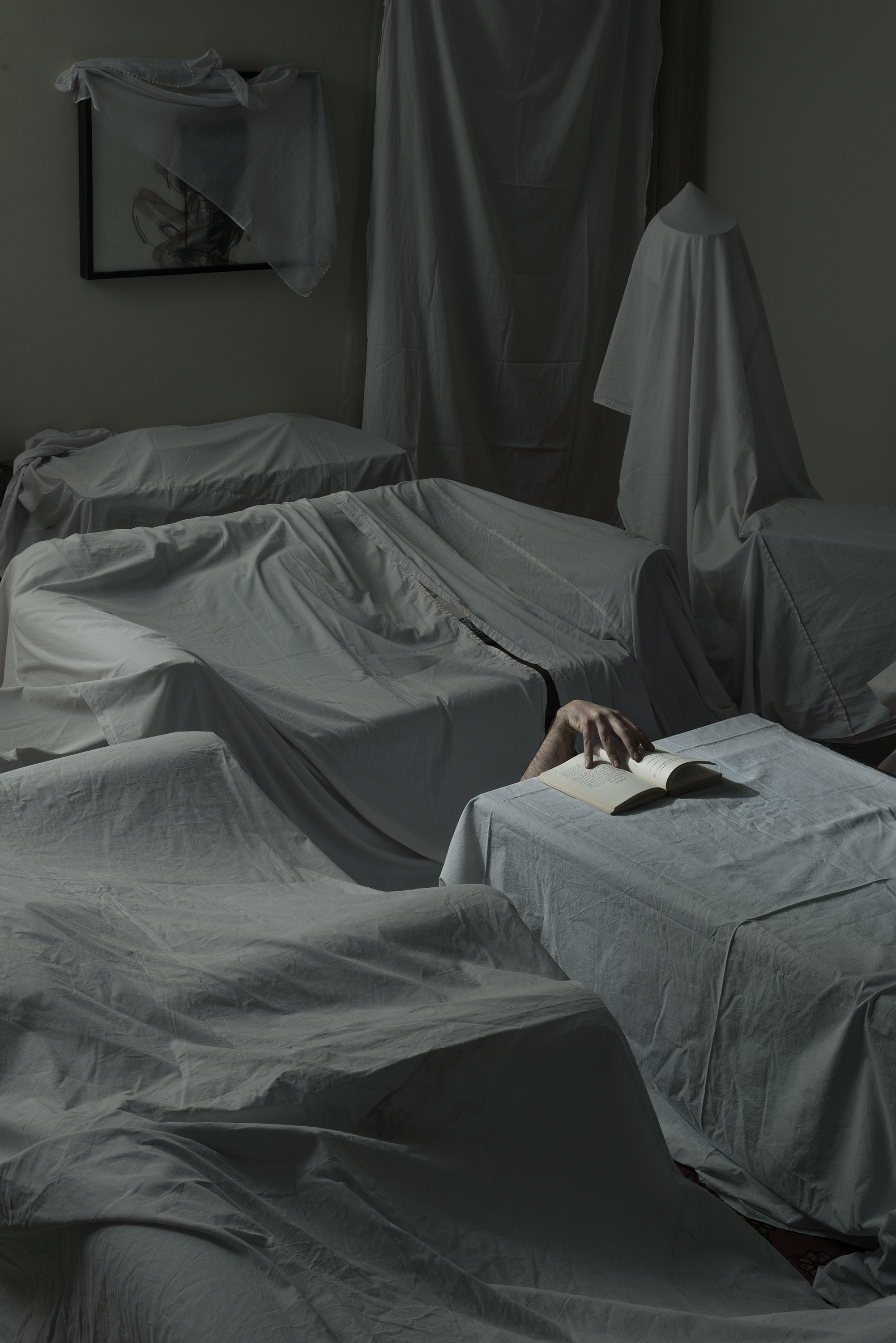 Artwork like a hand which keeps a book open in a vacant room by Mehrdad Emrani Artwork like a hand which keeps a book open in a vacant room by Mehrdad Emrani